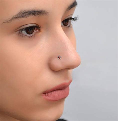 A more extreme type of nose piercing is the nasallang, a combination piercing that consists of a pair of nostril piercings with a septum piercing at the same level located between the two. . Nose stud